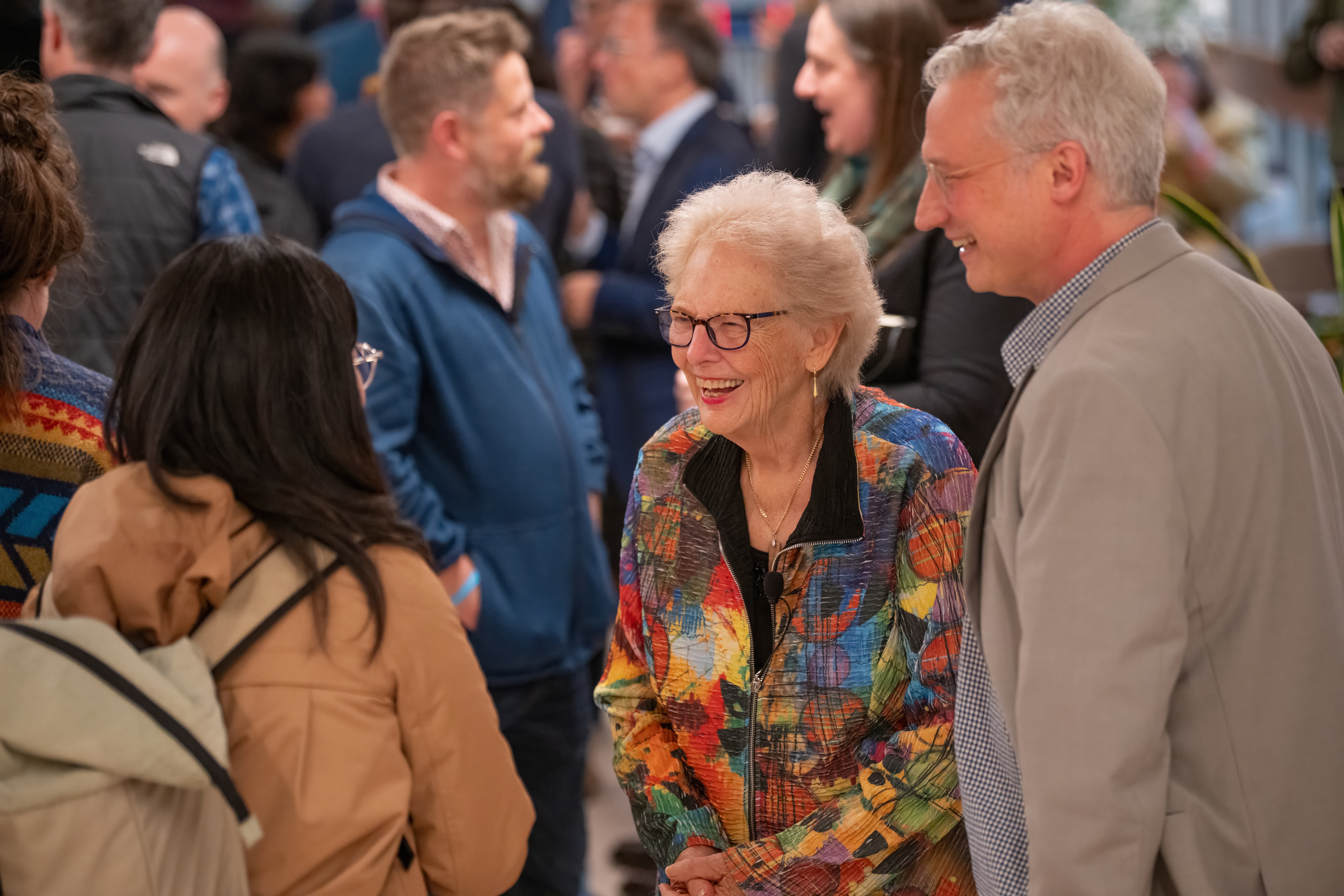 Professors Hayles and Danta talking with attendees

