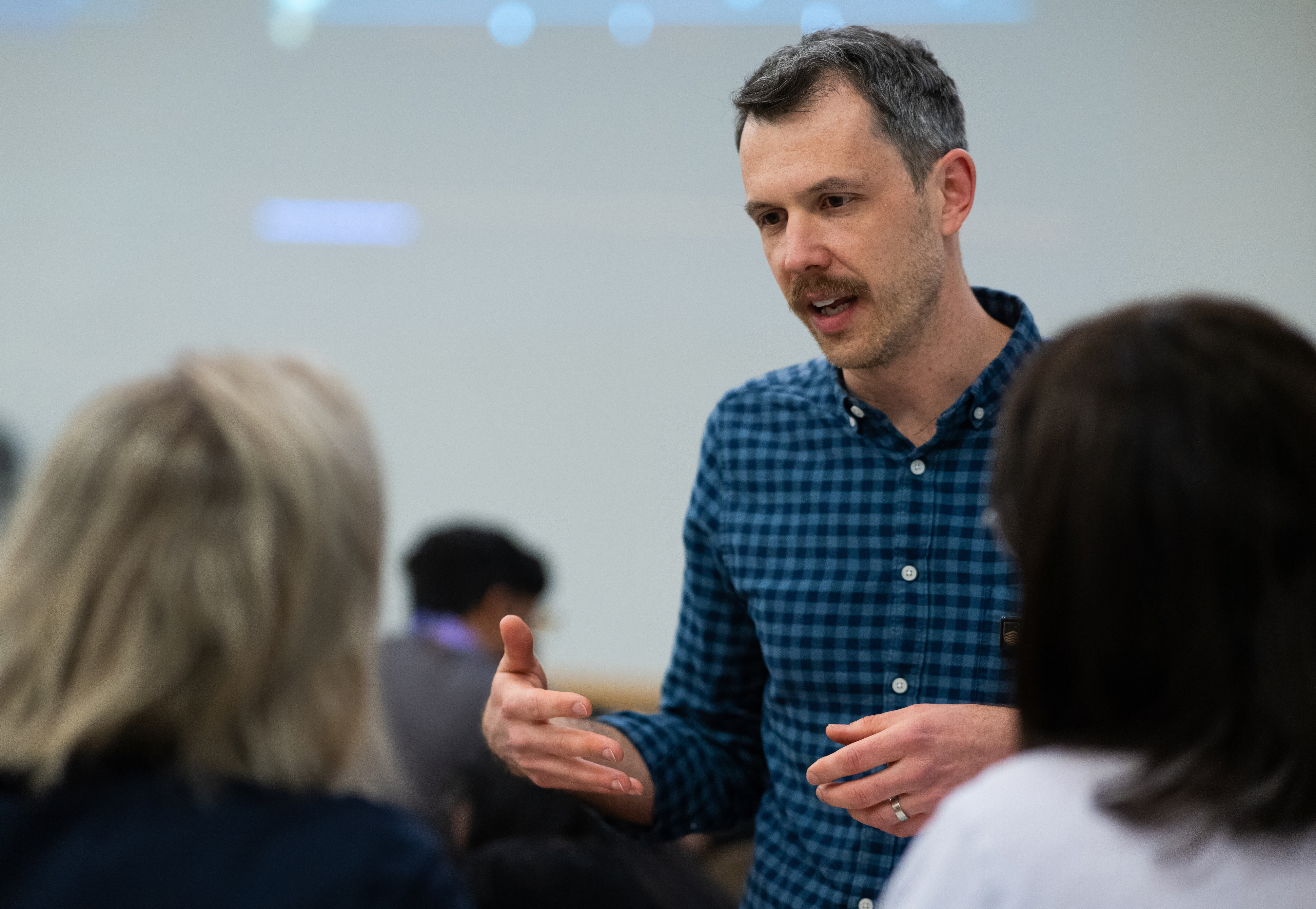 Cole Cooney with participants at My First LLM workshop. Photo Credit: Matt Jelly 