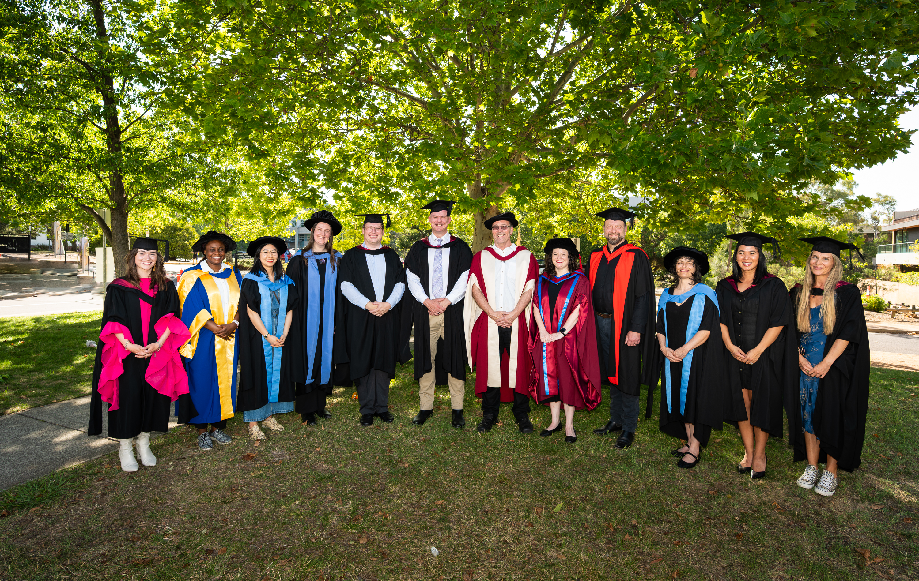 A group of people dressed up in academic robes