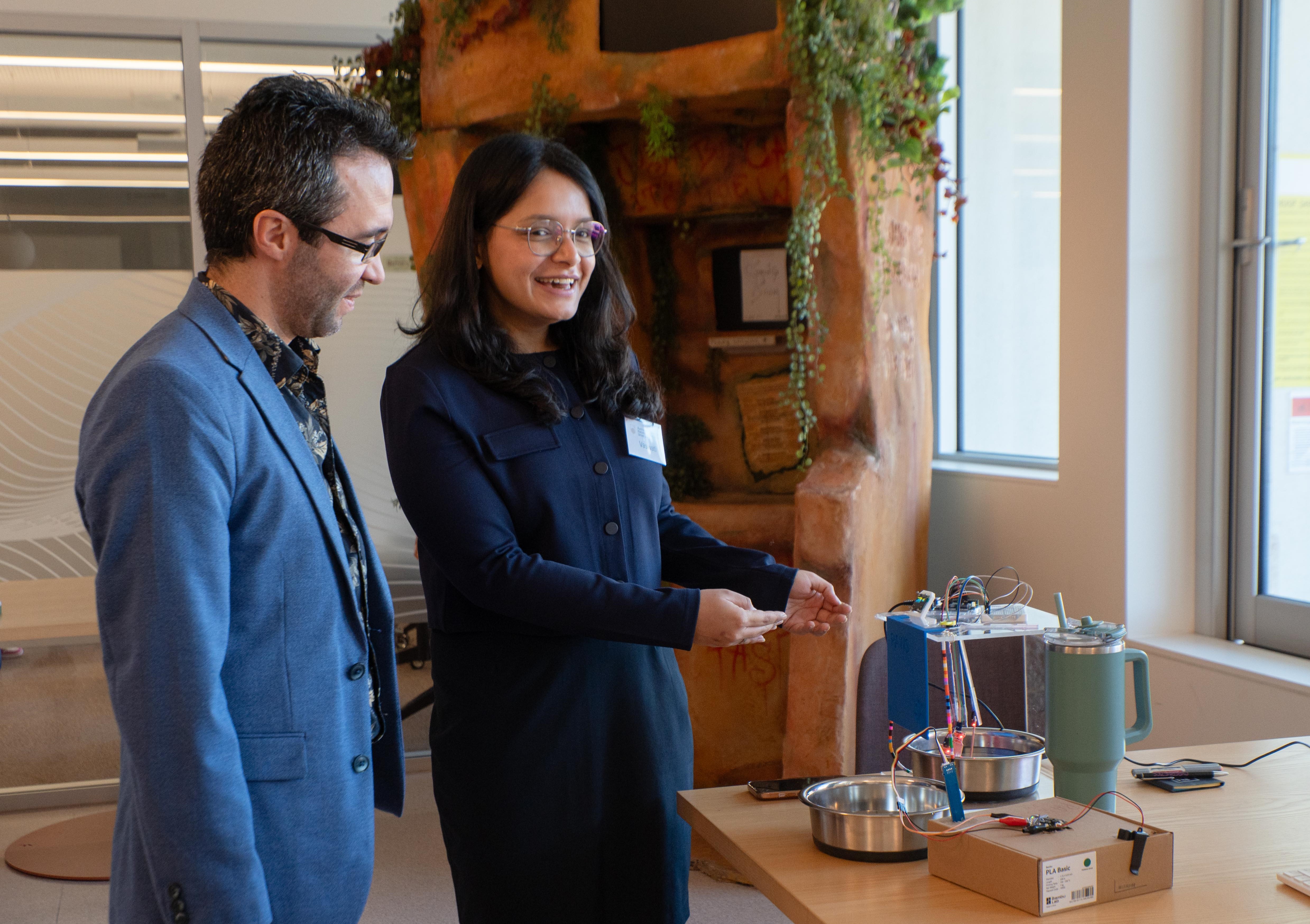 Vas explains her work to Human-Computer Interaction researcher Josh Andres