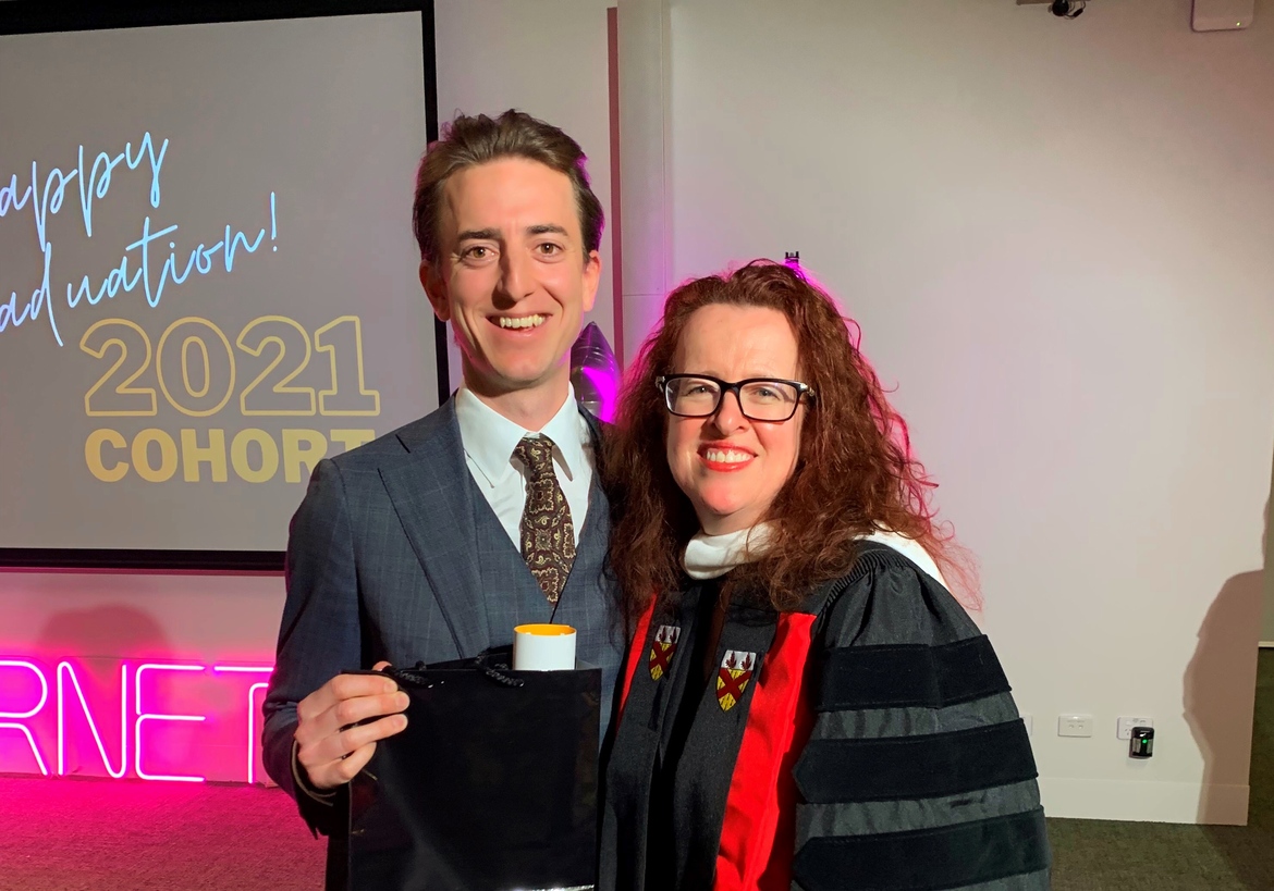 Julian Vido with School of Cybernetics Director Distinguished Professor Genevieve Bell during the 2022 mid-year graduation program.
